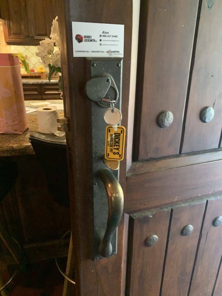 A door handle with a tag attached to it.